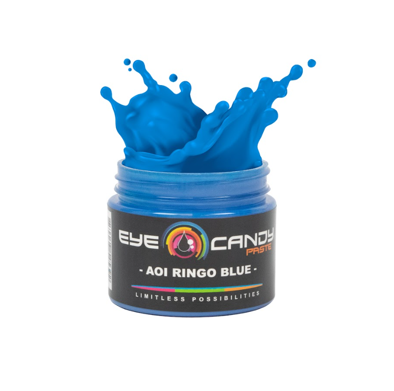 Bright blue pigment paste splashes upward from an open container. The container is labeled “Aoi Ringo Blue."